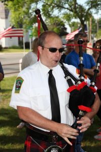 Firefighter Sean Peters on the bagpipes